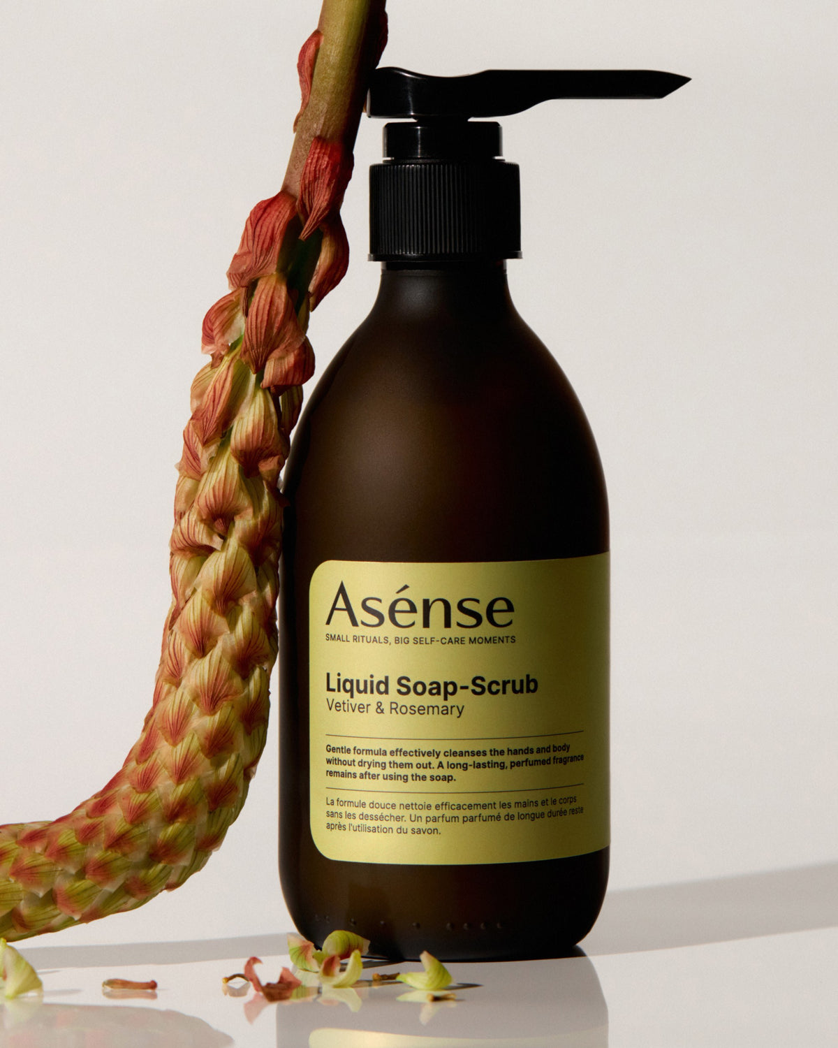 Asense Liquid Soap-Scrub Vetiver & Rosemary beside a dried flower
